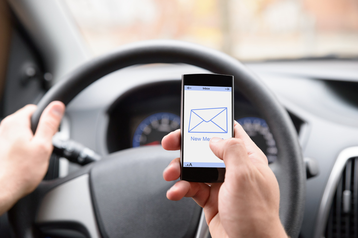 Man Using Cellphone While Driving